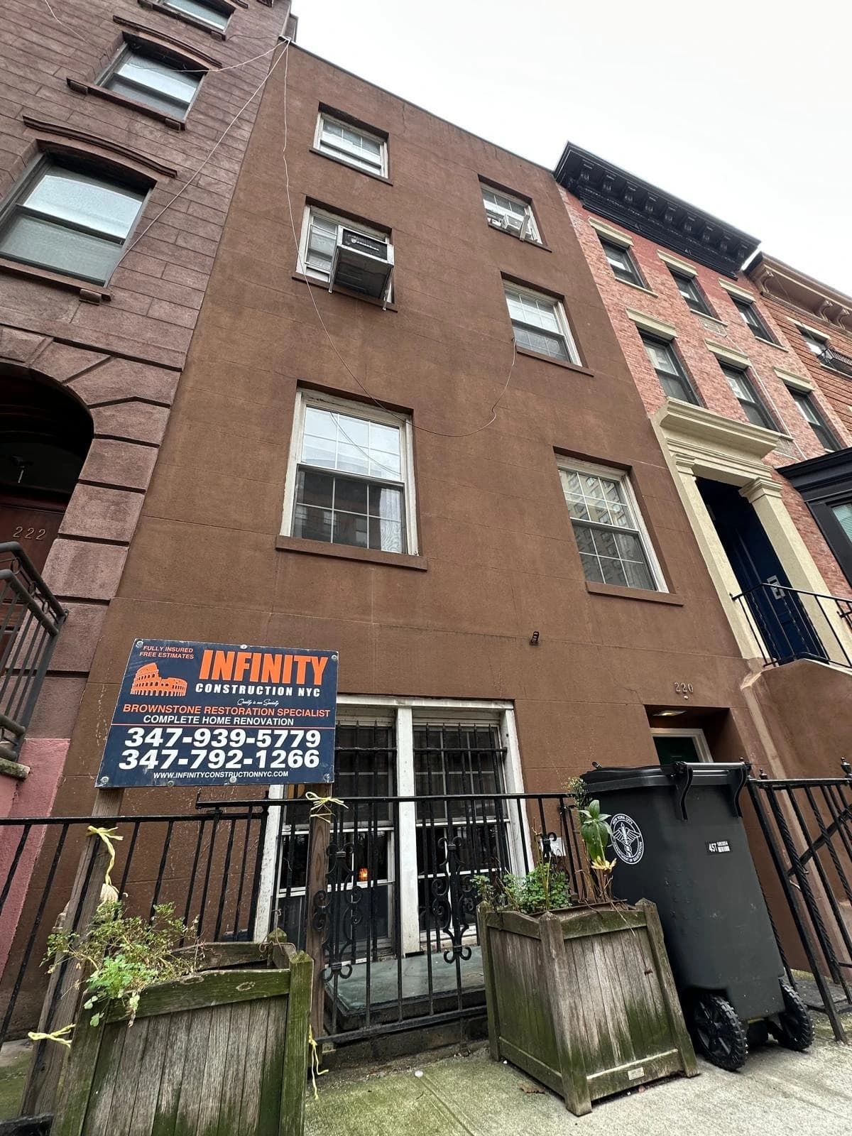 Elegant brownstone property with restored stone facade and front steps