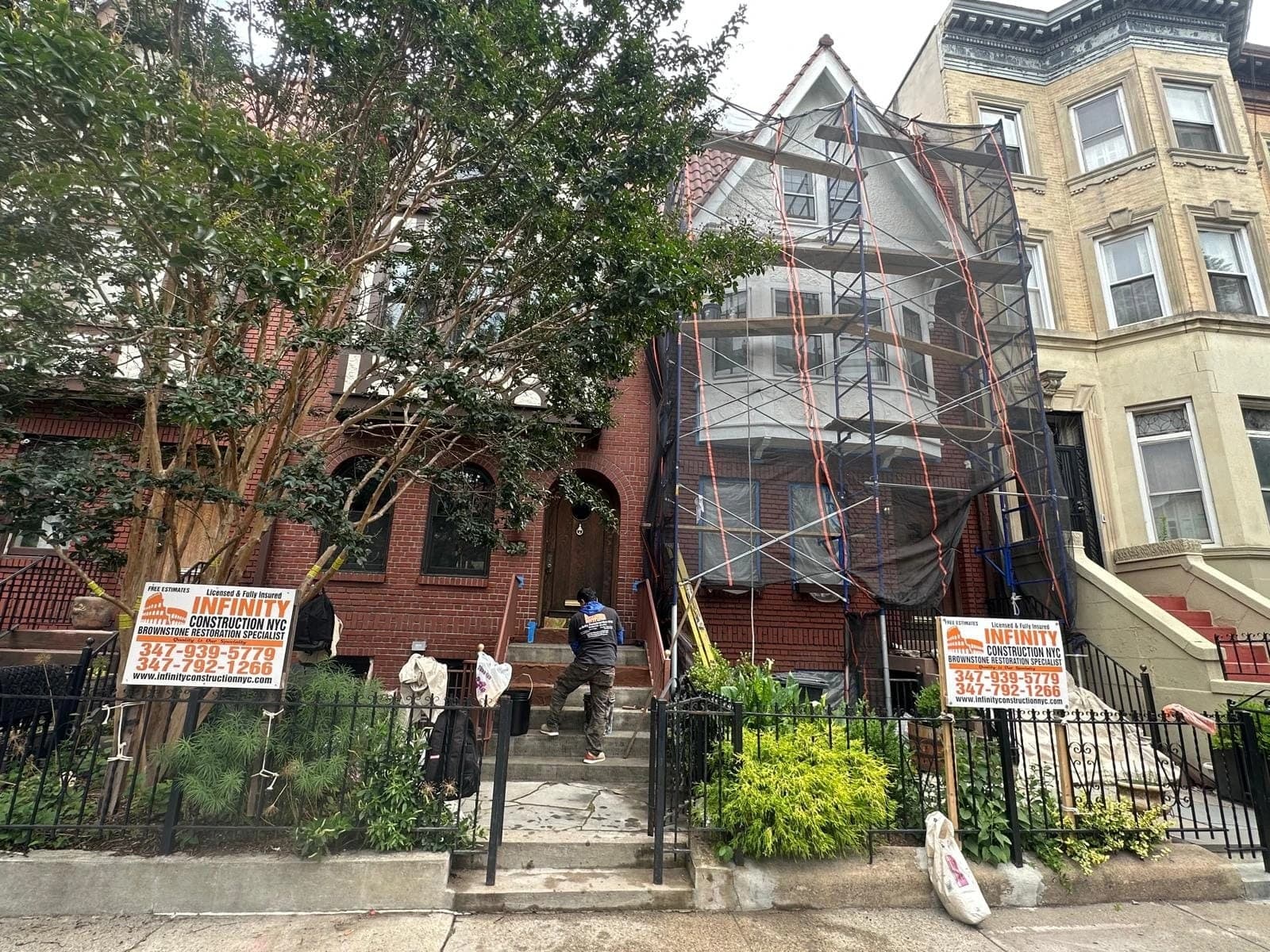 Elegant brownstone property with restored stone facade and front steps