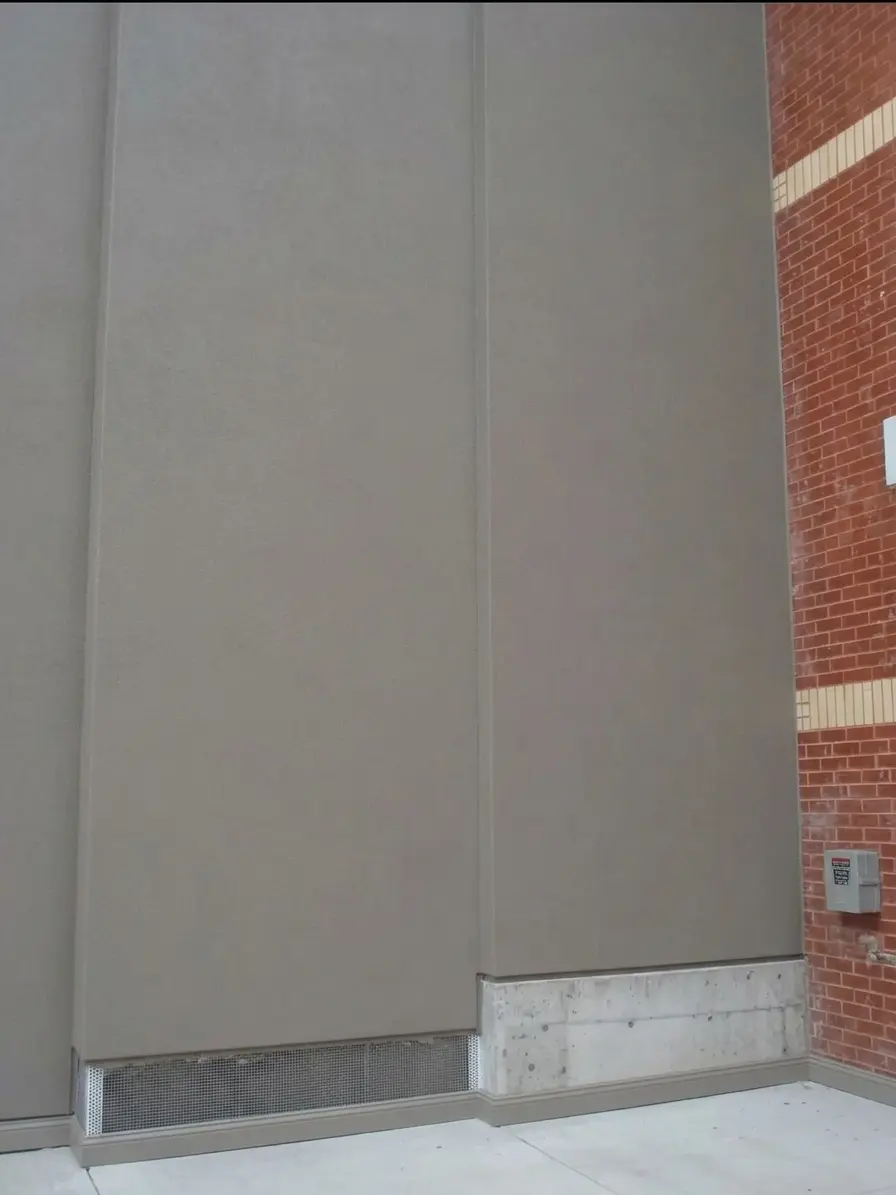 After masonry restoration showing completed brick and CMU block work with clean structural finish